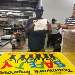 Travis holding Safety Award - One Year Accident Free
