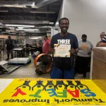 Denzel holding Safety Award - One Year Accident Free