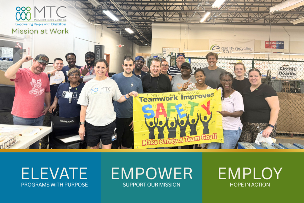 MTC Business Enterprise Team holding Safety Banner - Celebrating One Year Accident Free